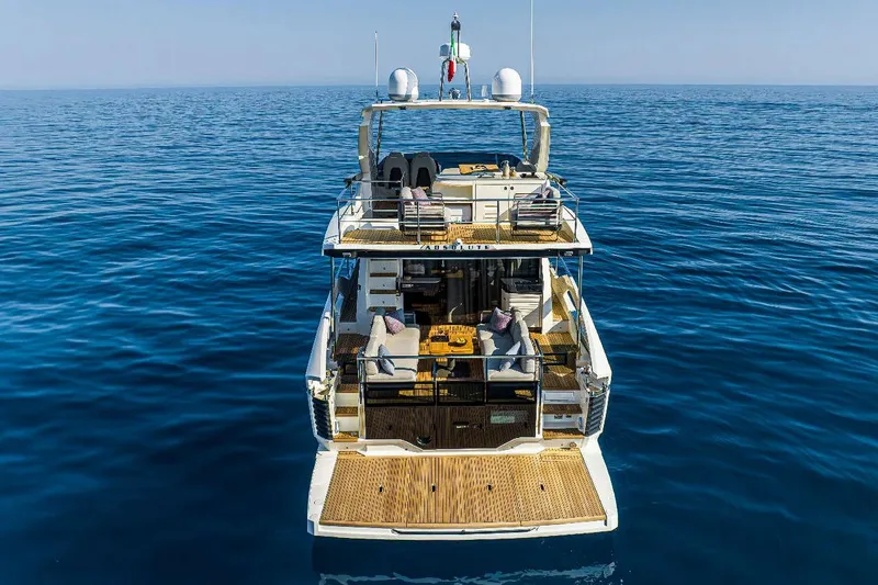 Yacht Photos Pics Luxury Absolute 52 FLY yacht, 2025 model, cruising on open sea.