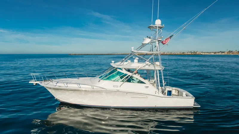 Apothecary Yacht Photos Pics 2011 Cabo Express yacht on calm ocean waters under clear blue sky.