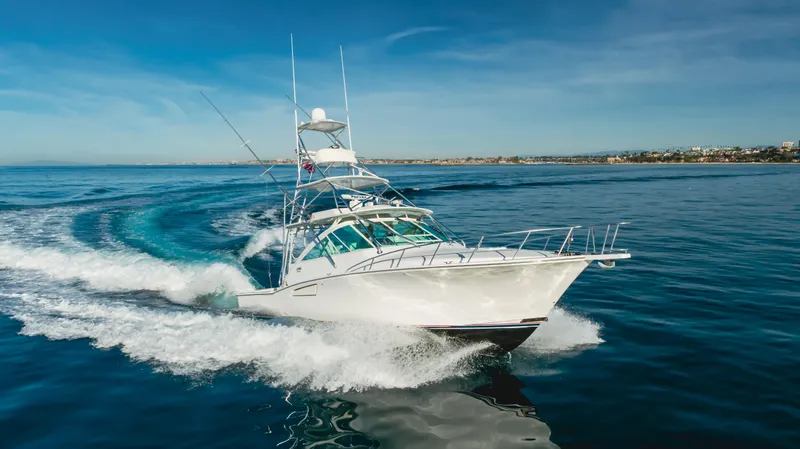 Apothecary Yacht Photos Pics 2011 Cabo Express yacht cruising swiftly on open water.