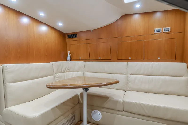 Apothecary Yacht Photos Pics Luxurious 2011 Cabo Express yacht interior with beige seating and wooden accents.