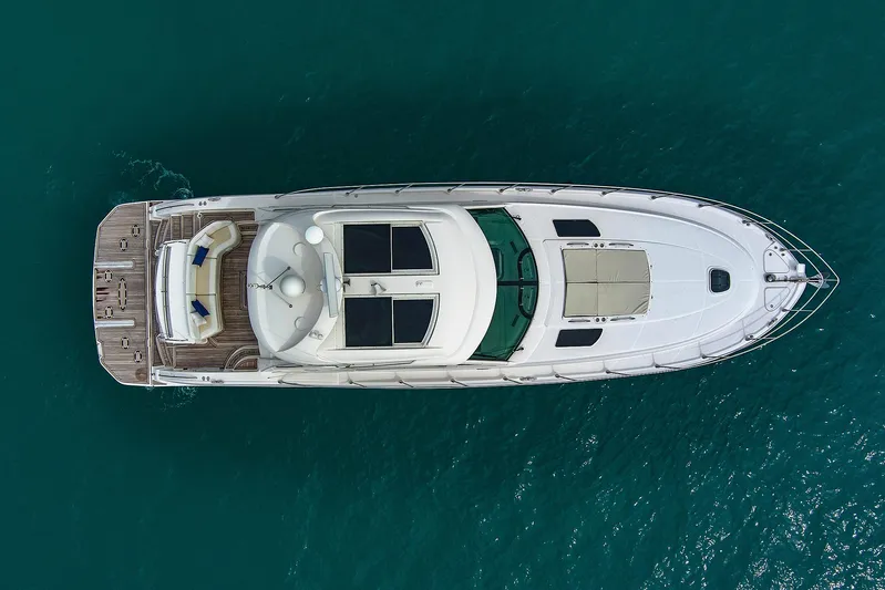 Majestic Stars Yacht Photos Pics Aerial view of 2012 Sea Ray Sundancer 580 yacht on turquoise water.