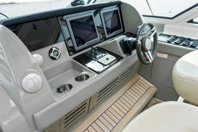 Majestic Stars Yacht Photos Pics 2012 Sea Ray Sundancer 580 helm with dual screens and modern controls.