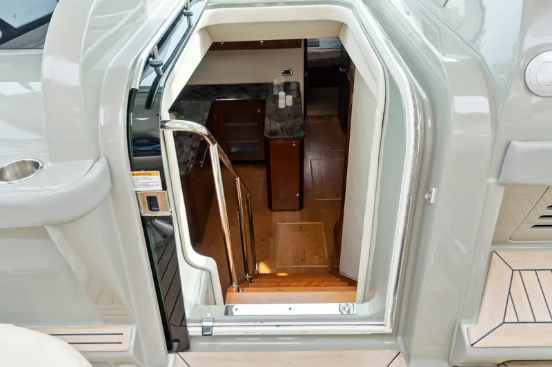 Majestic Stars Yacht Photos Pics Interior view of 2012 Sea Ray Sundancer 580 yacht, showing stairs and cabin entrance.