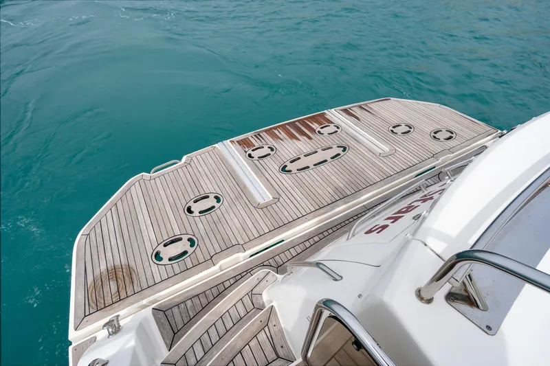 Majestic Stars Yacht Photos Pics 2012 Sea Ray Sundancer 580 swim platform on turquoise water.