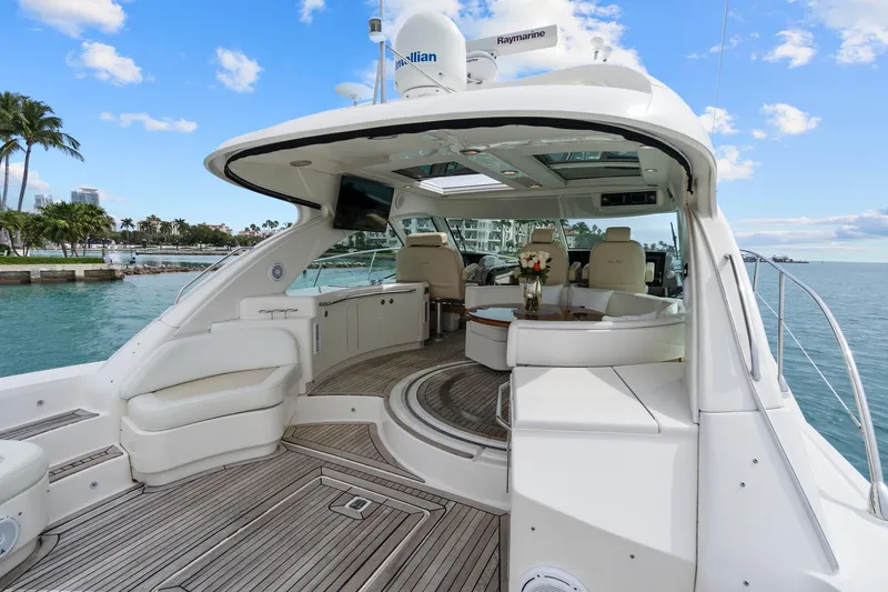 Majestic Stars Yacht Photos Pics 2012 Sea Ray Sundancer 580 yacht with luxurious deck and seating area.