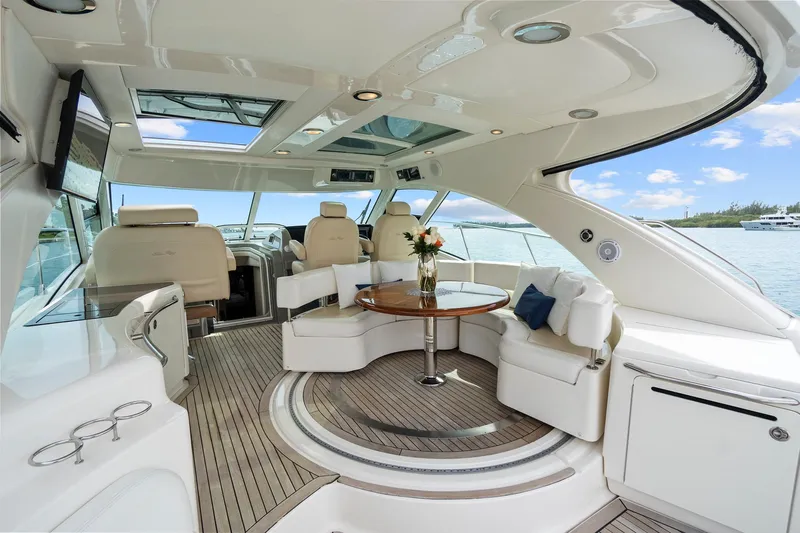 Majestic Stars Yacht Photos Pics Luxurious interior of 2012 Sea Ray Sundancer 580 yacht with elegant seating and table.
