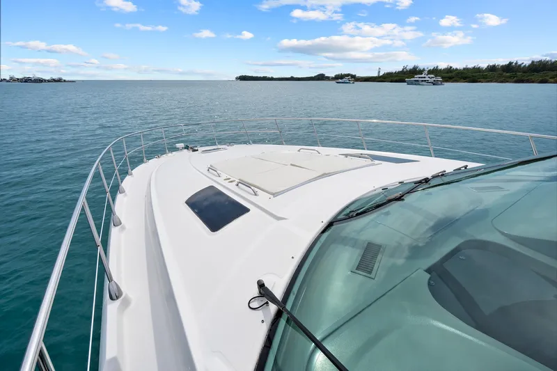 Majestic Stars Yacht Photos Pics 2012 Sea Ray Sundancer 580 yacht cruising on calm blue waters.