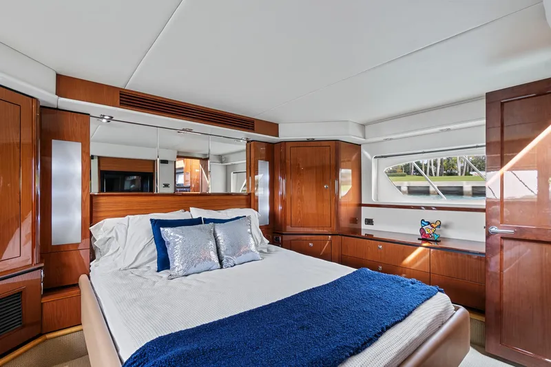 Majestic Stars Yacht Photos Pics Luxurious cabin interior of 2012 Sea Ray Sundancer 580 yacht with elegant wood finish.