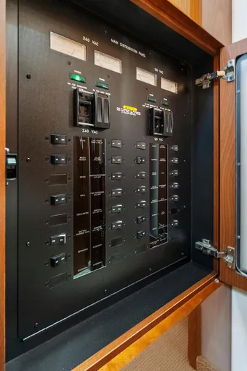 Majestic Stars Yacht Photos Pics Electrical panel inside 2012 Sea Ray Sundancer 580 yacht, showcasing circuit breakers and controls.