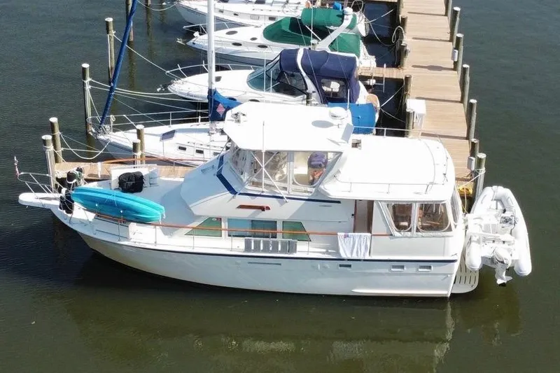 Sea Breeze Yacht Photos Pics 1985 Hatteras 43 Motor Yacht docked at marina, aerial view.
