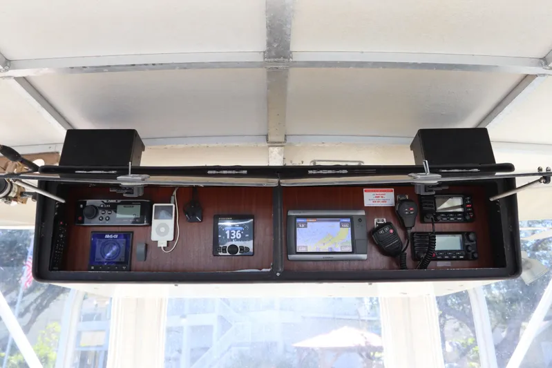 Sea Breeze Yacht Photos Pics Control panel of a 1985 Hatteras 43 Motor Yacht with navigation and communication equipment.