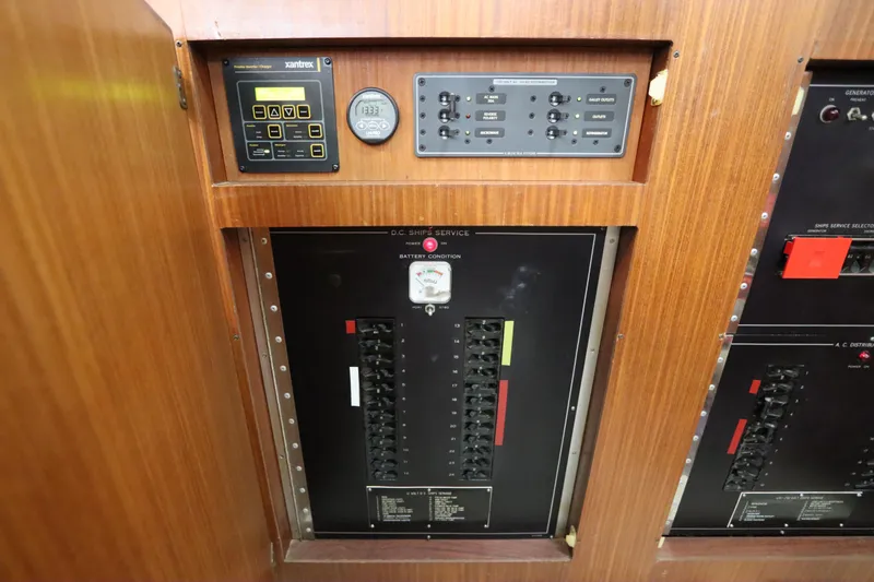 Sea Breeze Yacht Photos Pics Electrical panel of 1985 Hatteras 43 Motor Yacht with control switches and battery condition indicator.