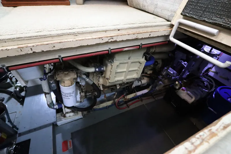 Sea Breeze Yacht Photos Pics Engine room of a 1985 Hatteras 43 Motor Yacht, showcasing mechanical components.