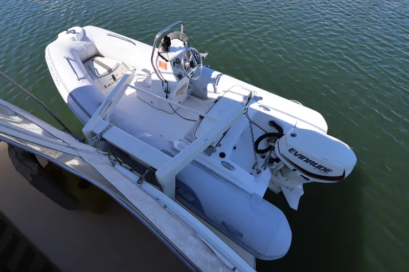 Sea Breeze Yacht Photos Pics Inflatable boat with Evinrude motor docked beside 1985 Hatteras 43 Motor Yacht.