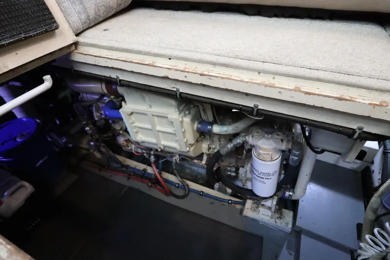 Sea Breeze Yacht Photos Pics Engine room of 1985 Hatteras 43 Motor Yacht, showcasing mechanical components and filters.