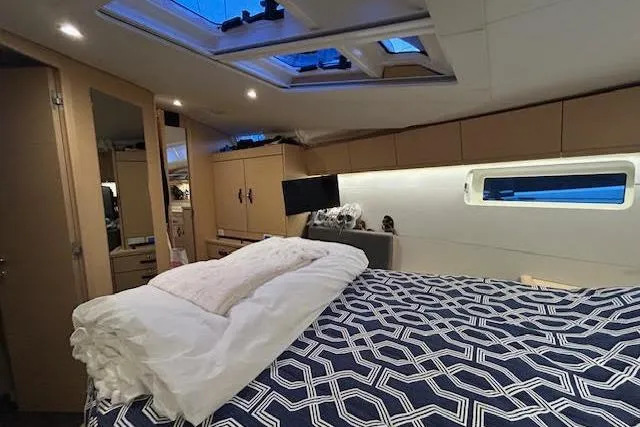 Agua Especial Yacht Photos Pics Luxurious interior of 2016 Jeanneau 54 yacht with skylights and modern bedding.