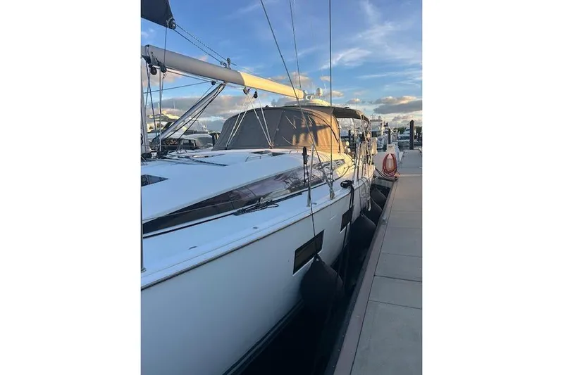 Agua Especial Yacht Photos Pics 2016 Jeanneau 54 sailboat docked at marina under a clear sky.