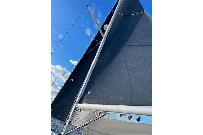 Agua Especial Yacht Photos Pics Sailing yacht Jeanneau 54, 2016 model, with sails unfurled against a clear blue sky.
