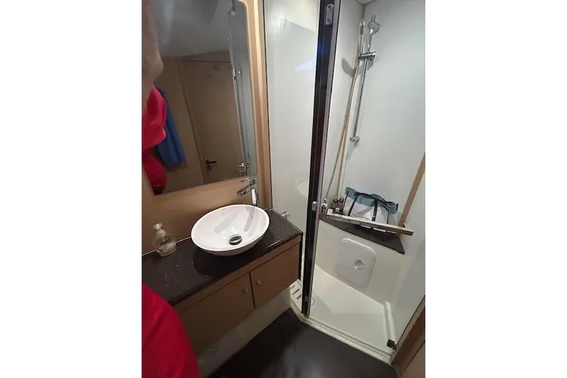Agua Especial Yacht Photos Pics Bathroom interior of 2016 Jeanneau 54 yacht with sink and shower.