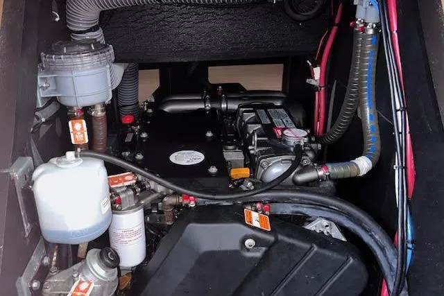 Agua Especial Yacht Photos Pics Engine compartment of a 2016 Jeanneau 54 sailboat, showcasing mechanical components and wiring.