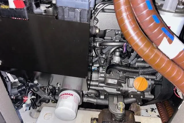 Agua Especial Yacht Photos Pics Engine compartment of a 2016 Jeanneau 54 sailboat, featuring Yanmar components and wiring.