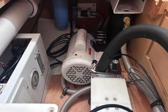 Agua Especial Yacht Photos Pics Engine compartment of a 2016 Jeanneau 54 yacht, showcasing mechanical components and wiring.