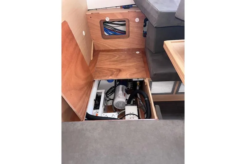 Agua Especial Yacht Photos Pics Interior view of 2016 Jeanneau 54 yacht, showcasing under-seat storage and equipment.