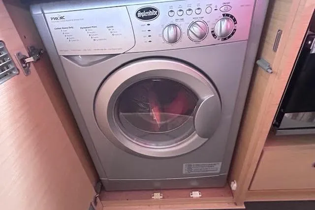 Agua Especial Yacht Photos Pics Washing machine inside 2016 Jeanneau 54 yacht's wooden cabinet.