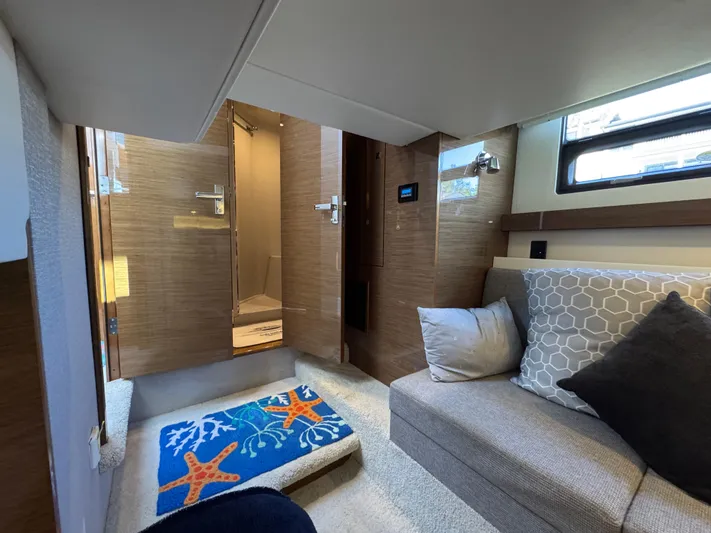 Truly Ineffable Yacht Photos Pics Interior of 2019 Cruisers Yachts 42 Cantius with cozy seating and nautical decor.