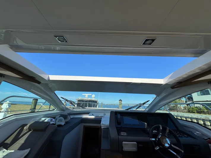 Truly Ineffable Yacht Photos Pics Interior view of 2019 Cruisers Yachts 42 Cantius with open sunroof and helm.