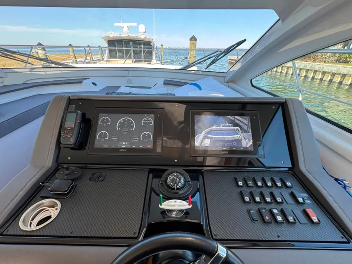 Truly Ineffable Yacht Photos Pics 2019 Cruisers Yachts 42 Cantius helm with navigation screens and controls.