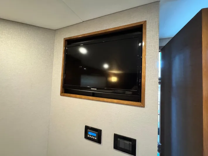 Truly Ineffable Yacht Photos Pics Samsung TV in 2019 Cruisers Yachts 42 Cantius interior, wall-mounted with control panel.