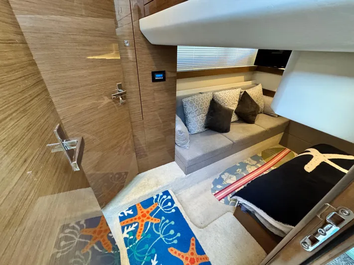 Truly Ineffable Yacht Photos Pics 2019 Cruisers Yachts 42 Cantius interior with cozy seating and nautical-themed decor.