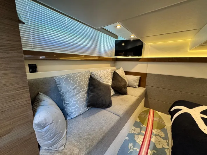 Truly Ineffable Yacht Photos Pics Luxurious interior of 2019 Cruisers Yachts 42 Cantius with cozy seating and modern decor.