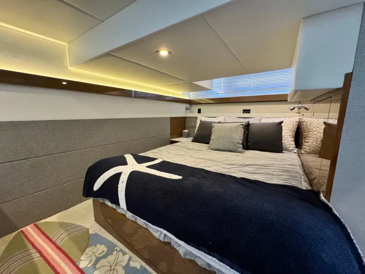 Truly Ineffable Yacht Photos Pics Luxurious bedroom interior of 2019 Cruisers Yachts 42 Cantius with modern design and cozy bedding.