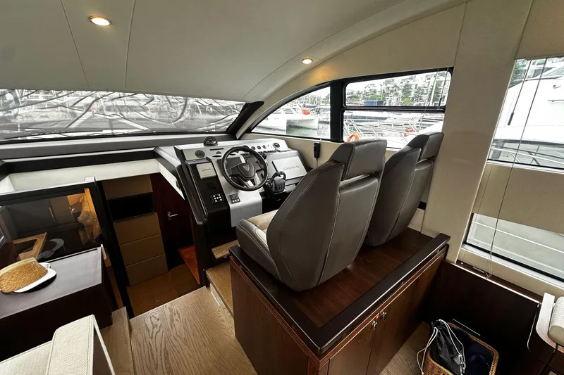  Yacht Photos Pics 2023 Fairline Squadron 50 yacht interior with modern helm and leather seating.