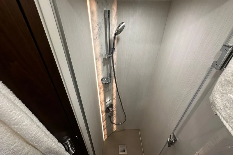  Yacht Photos Pics Shower area in 2023 Fairline Squadron 50 yacht, featuring modern fixtures and elegant design.