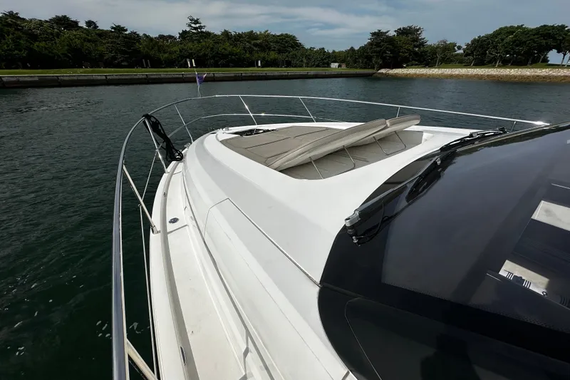  Yacht Photos Pics 2023 Fairline Squadron 50 yacht with sleek deck design and luxurious sunbathing area.