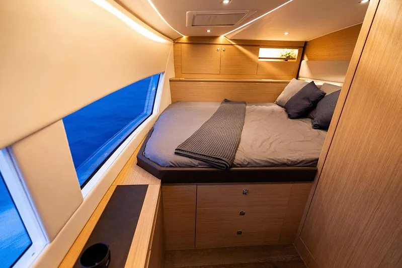  Yacht Photos Pics Luxurious cabin interior of 2025 Makai M37 yacht with cozy bed and modern design.