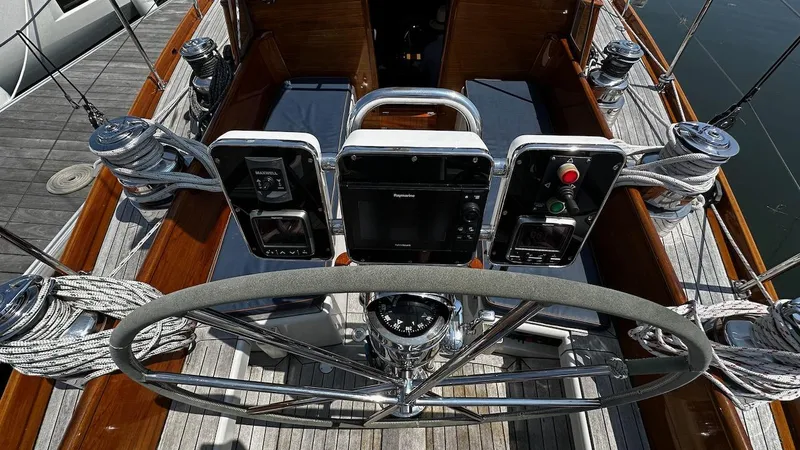 Nala Yacht Photos Pics Cockpit of 2004 Lyman-Morse Sparkman & Stephens Sloop with steering wheel and navigation controls.