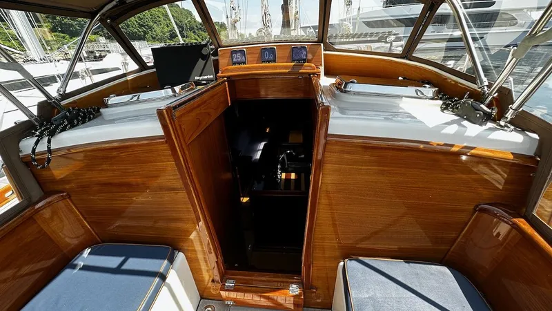 Nala Yacht Photos Pics Interior view of 2004 Lyman-Morse Sparkman & Stephens Sloop, featuring polished wood and seating.