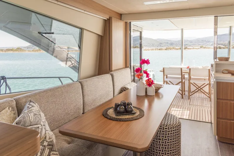  Yacht Photos Pics Luxurious interior of 2021 Greenline OceanClass 68 yacht with elegant dining area and scenic views.