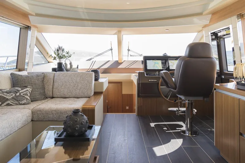  Yacht Photos Pics Luxurious interior of 2021 Greenline OceanClass 68 yacht with modern helm and seating area.