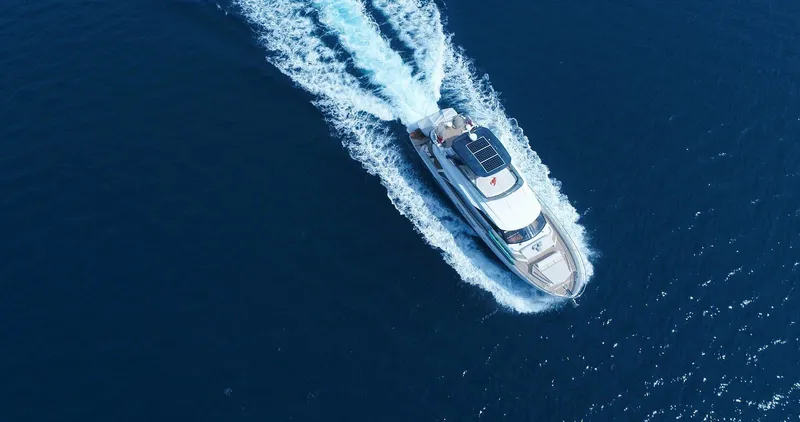  Yacht Photos Pics Aerial view of 2021 Greenline OceanClass 68 yacht cruising on open water.