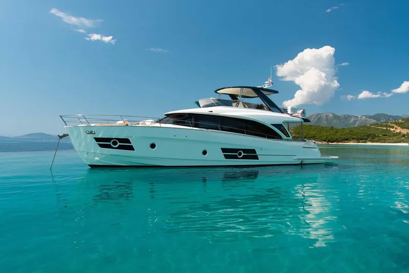  Yacht Photos Pics 2021 Greenline OceanClass 68 yacht on clear turquoise water, under a bright blue sky.
