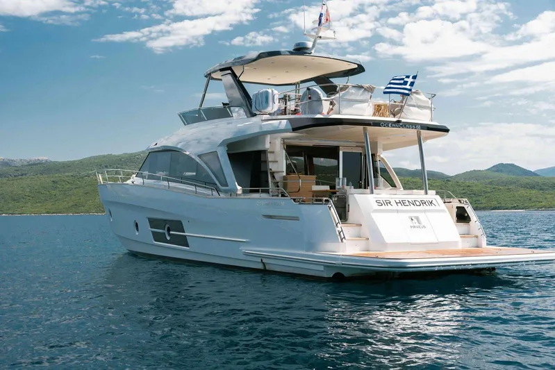  Yacht Photos Pics 2021 Greenline OceanClass 68 yacht on serene water with scenic background.