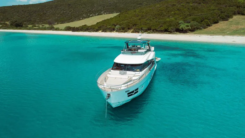  Yacht Photos Pics Luxury Greenline OceanClass 68 yacht anchored in clear turquoise waters, 2021 model.