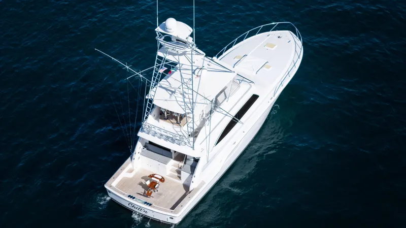 Chill 'n Yacht Photos Pics 2003 Bertram 67 Convertible yacht on open water, aerial view.