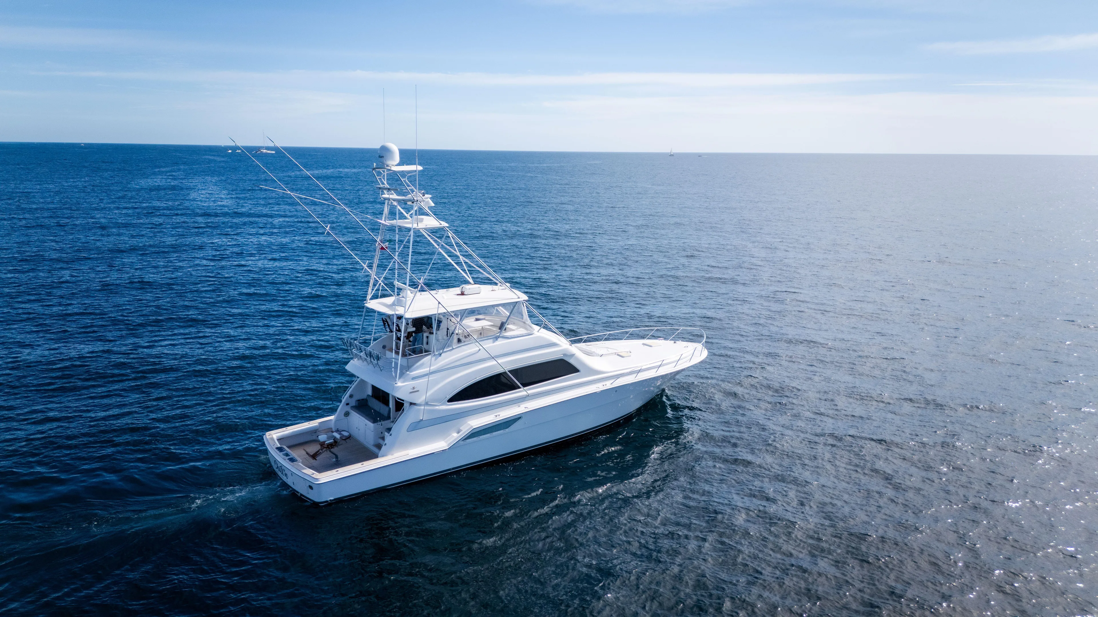 Chill 'n Yacht Photos Pics 2003 Bertram 67 Convertible yacht cruising on open sea.