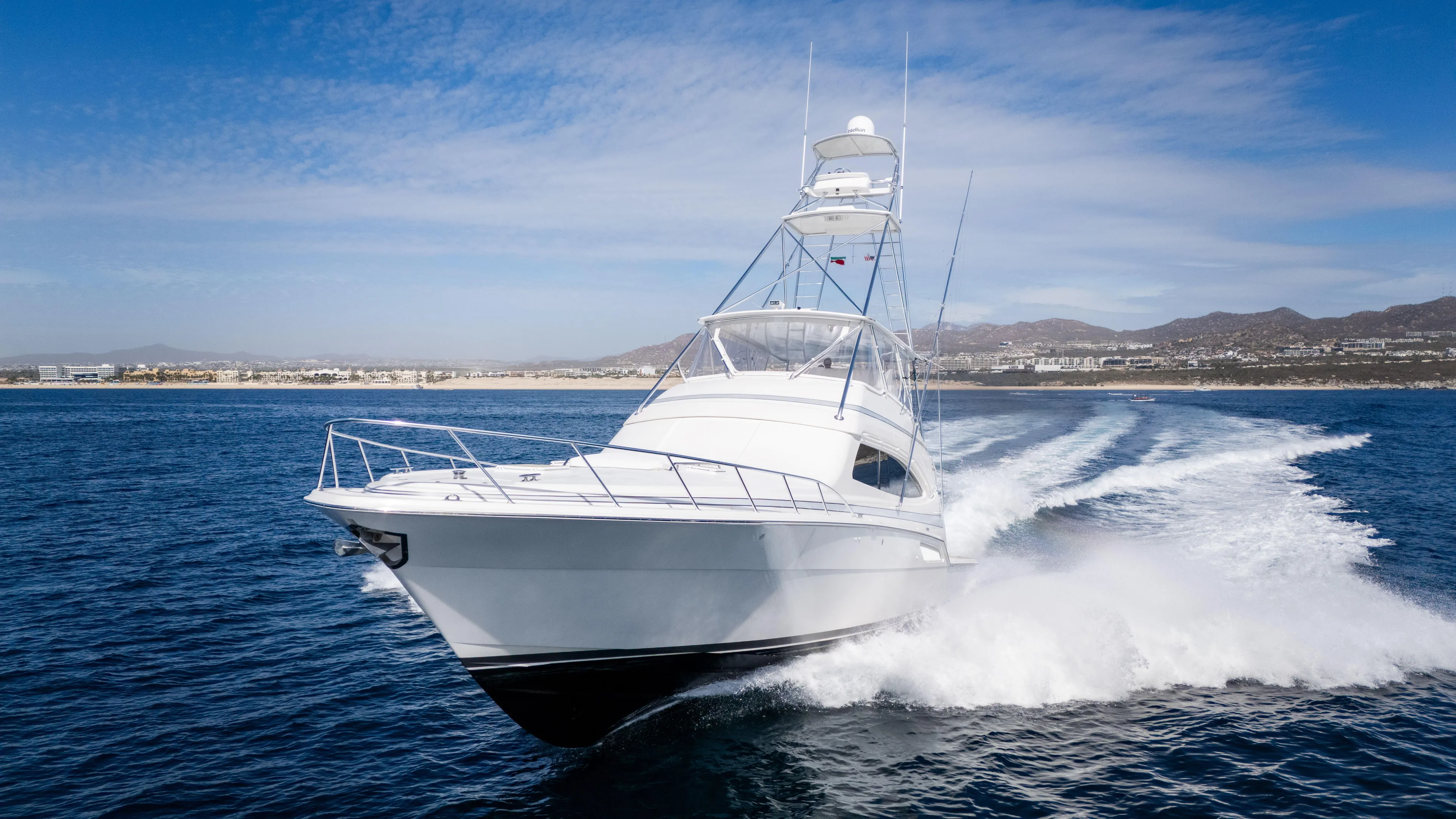 Chill 'n Yacht Photos Pics 2003 Bertram 67 Convertible yacht cruising on open water, creating a dynamic wake.